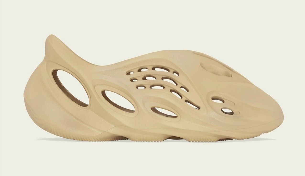 adidas Yeezy Foam RNNR Desert Sand product image of a light beige slide-on sneaker.