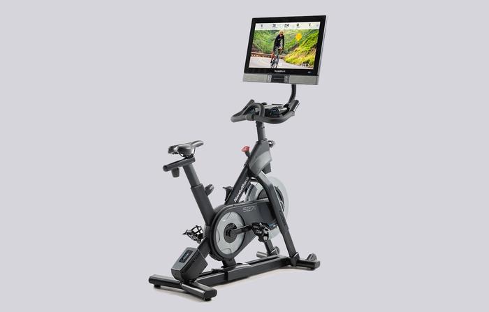 Best exercise bike NordicTrack product image of a dark grey framed bike with large HD touchscreen display.