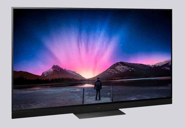 Latest TV news for sports games Panasonic product image of a black TV with mountains on its display.