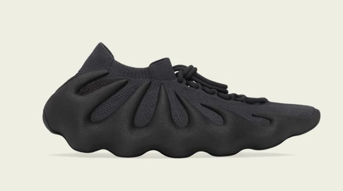 adidas Yeezy 450 "Utility Black" product image of an all-black Primeknit sneaker with a foam lattice midsole.