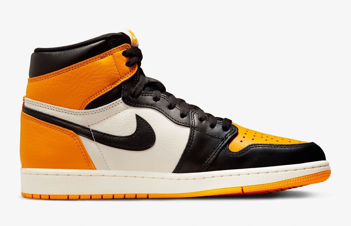 Air Jordan 1 High OG "Taxi" product image of a white and black sneaker with yellow overlays. 