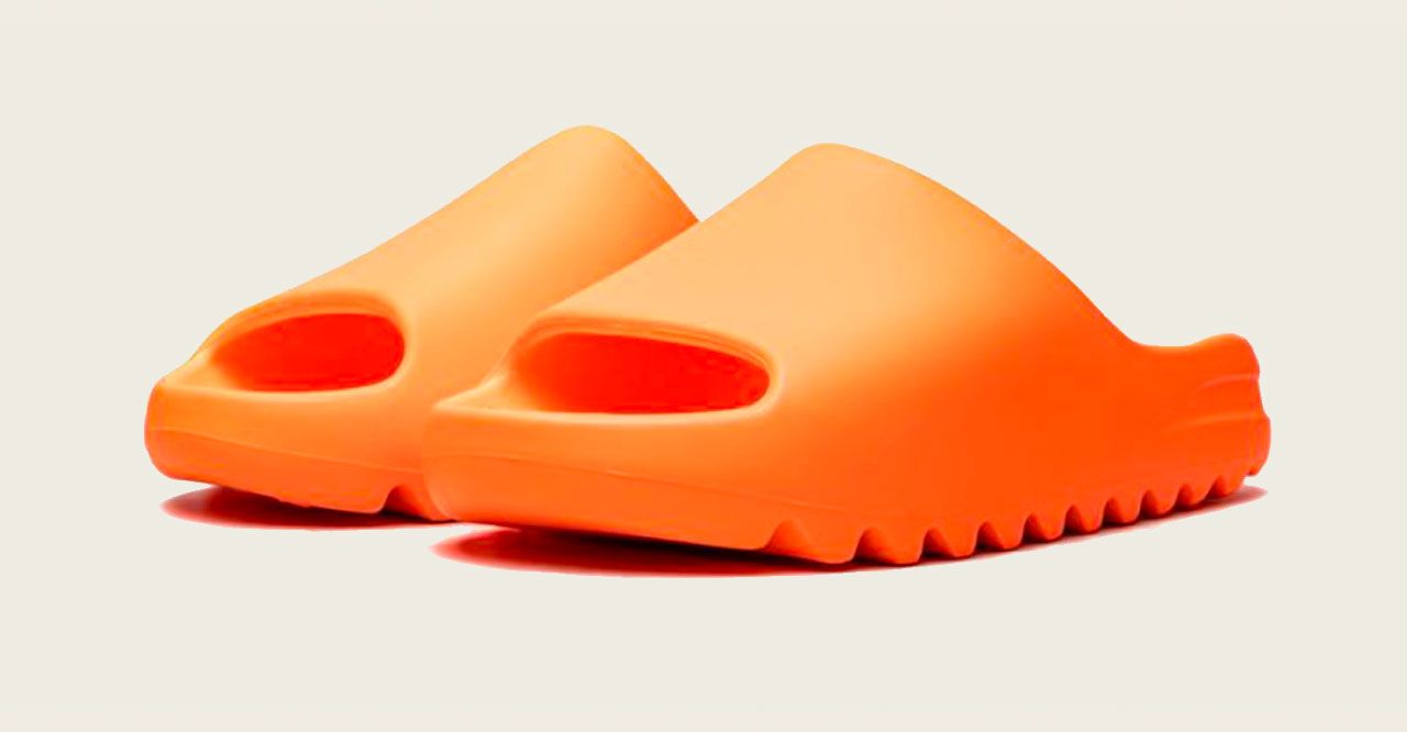 Best Yeezys Slide "Enflame Orange" product image of a bright orange pair of sliders.