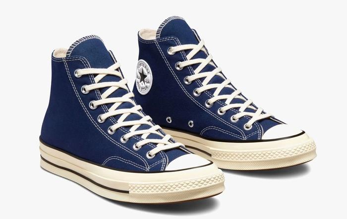 Best Converse Chuck Taylor All Star product image of a pair of dark blue sneakers with erget-coloured midsoles and laces.