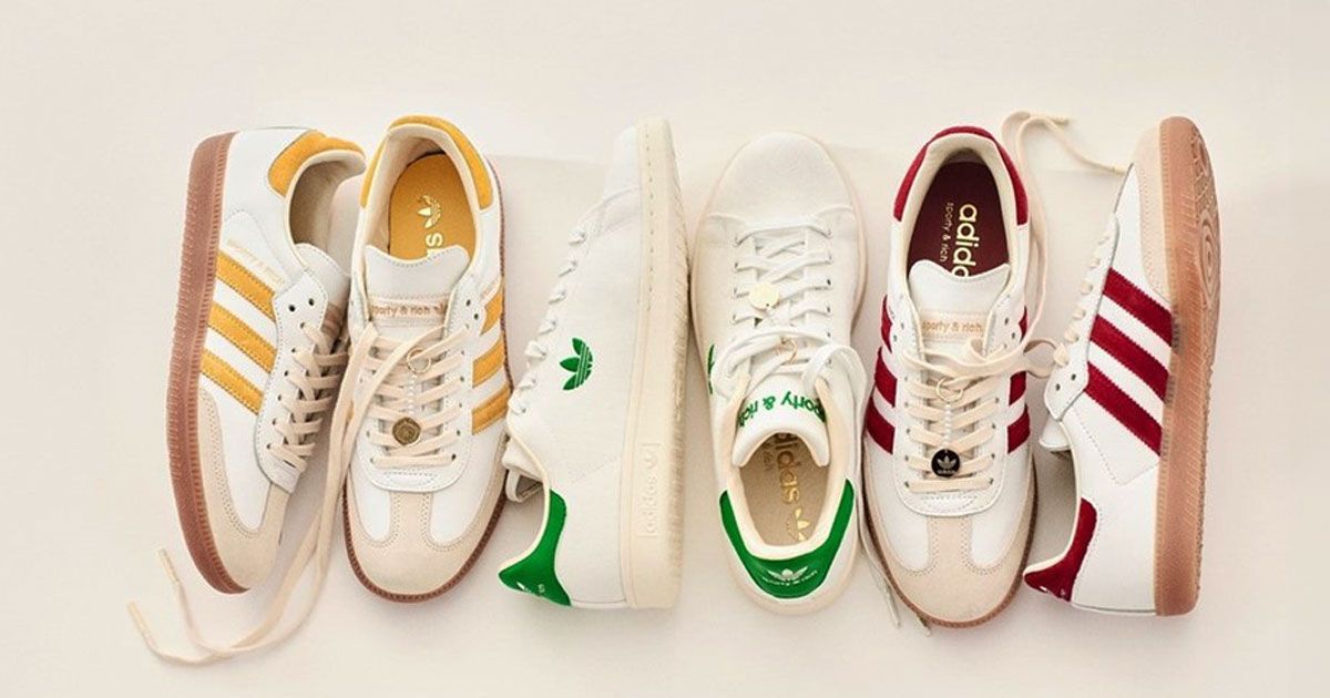 A selection of cream and white adidas Sambas next to each other, one pair featuring yellow details, one with green, and the final with burgundy accents.