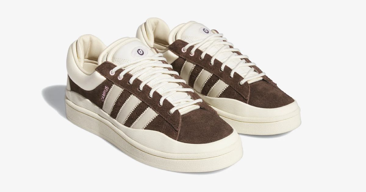 A brown suede and cream pair of adidas sneakers featuring pink Campus branding down the side.