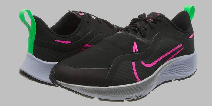 Best Winter running shoes Nike product image of a pair of black trainers with pink and green accents.