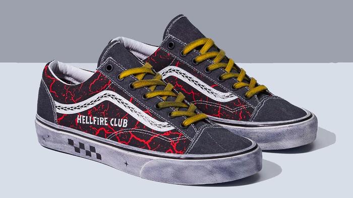 Best sneaker collabs - Stranger Things x Vans Style 36 product image of a black pair of shoes with white midsoles, distressed yellow laces, and a red pattern along the sides.