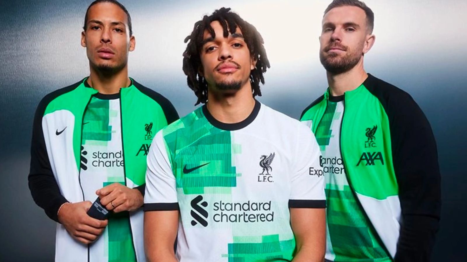 Liverpool Nike Away Kit product image of van Dijk, Alexander-Arnold, and Henderson wearing white kits featuring a green chequered pattern and black collars.
