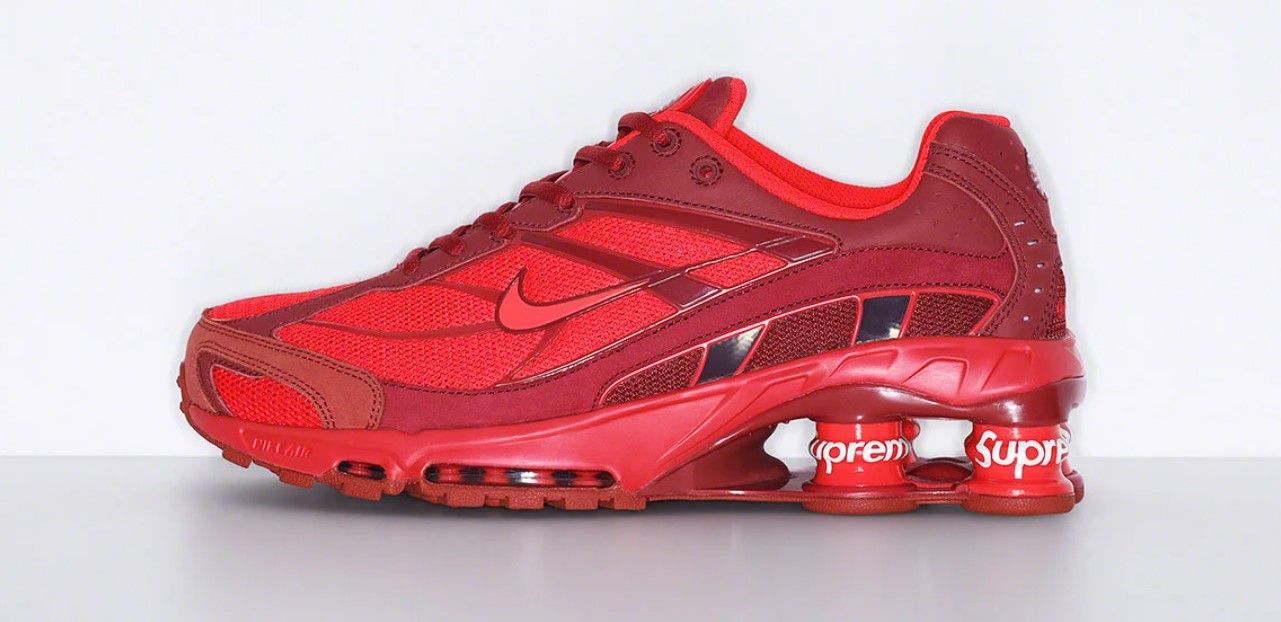 Supreme x Nike Shox Ride 2 product image of a red pair of sneakers with Supreme-branded cushioning columns in the heels.