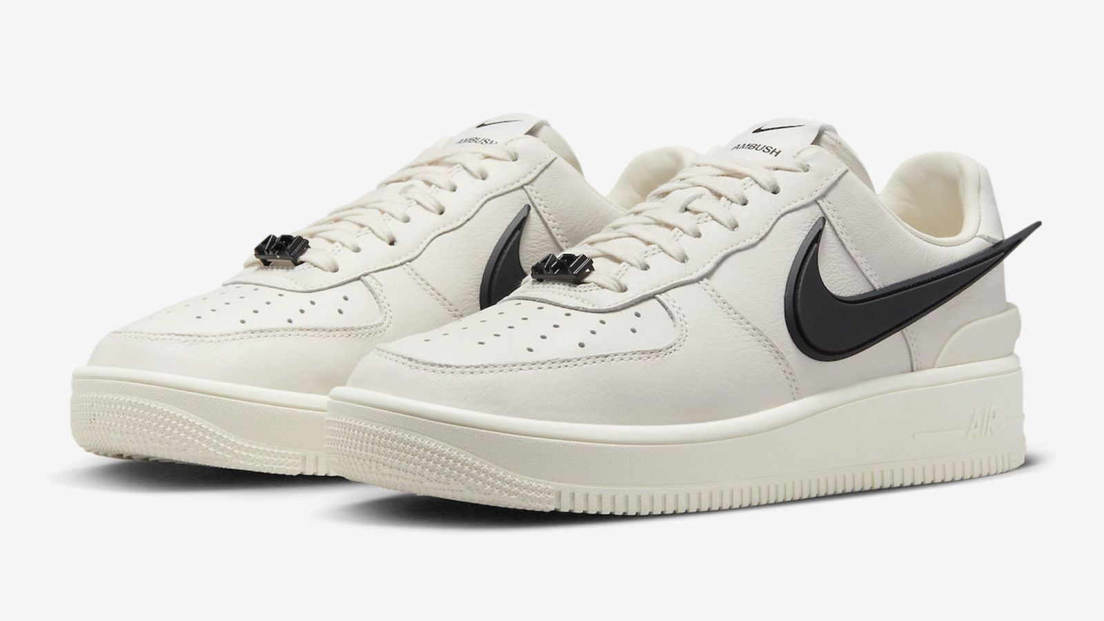 AMBUSH x Nike Air Force 1 Low "White" product image of an off-white pair of Air Force 1s featuring oversized black Nike branding.