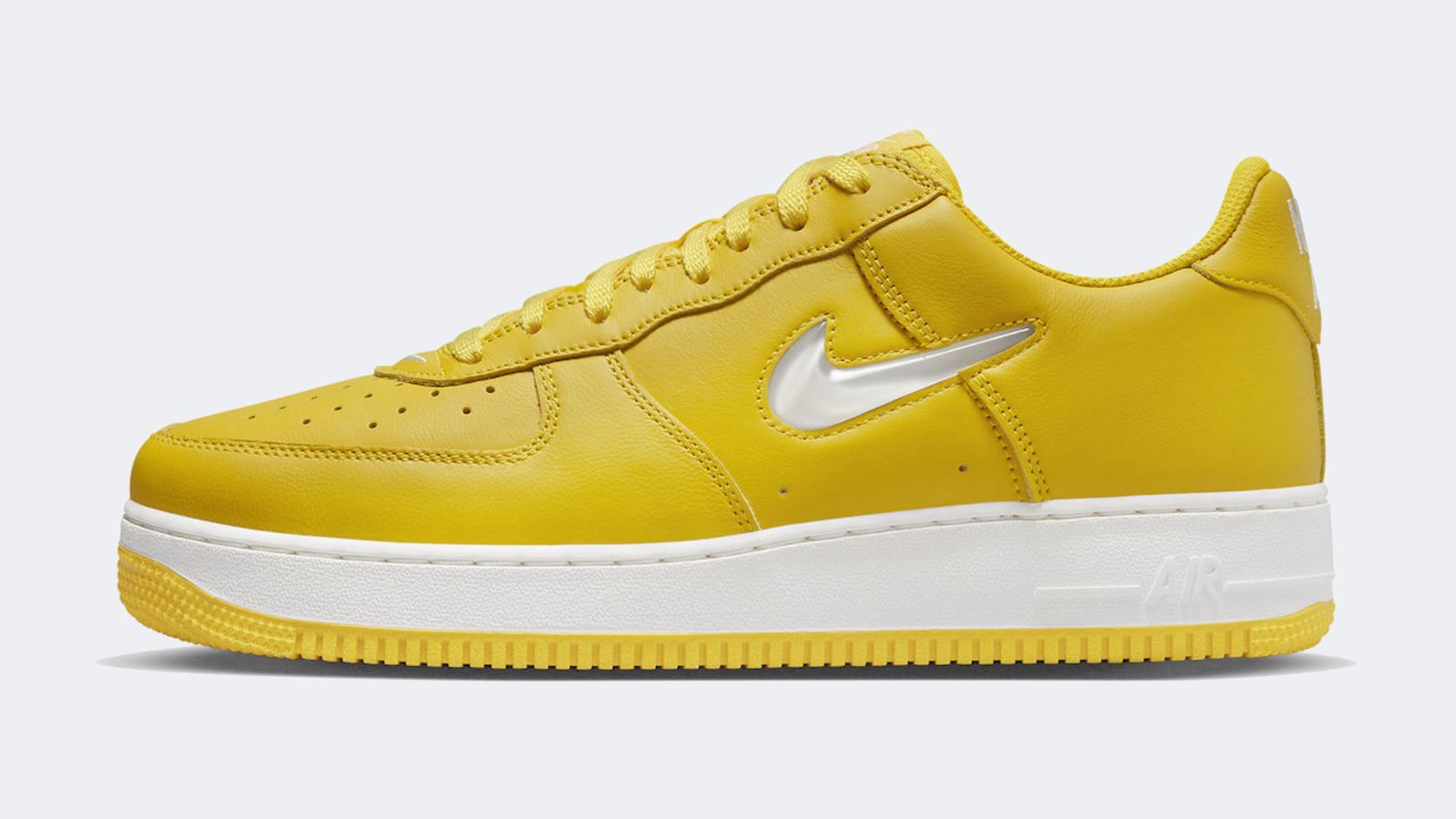 Nike Air Force 1 Low Colour of the Month "Jewel Yellow" product image of a bright yellow sneaker featuring a white midsole and small transparent Swoosh on the side.