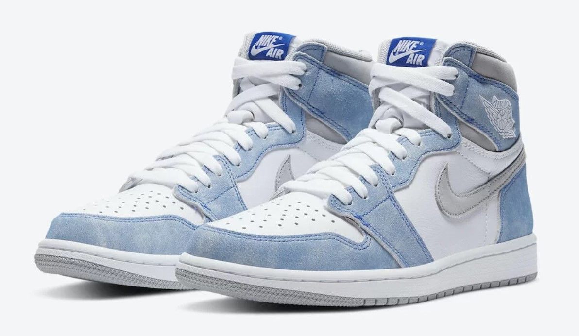 Air Jordan 1 "Hyper Royal" product image of a white and light blue suede pair of sneakers.
