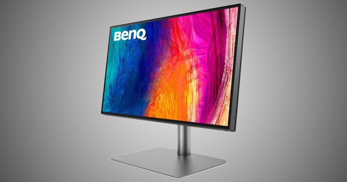 BenQ PD2725U product image od a dark grey and black monitor with streaks of blue, orange, and pink on the display.