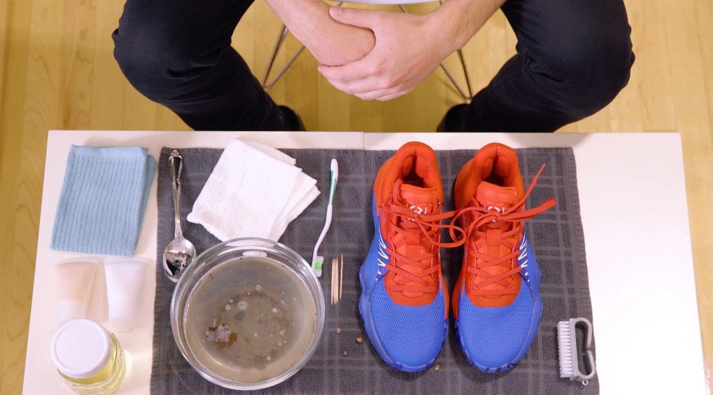 adidas product image on how to clean a red and blue pair of basketball shoes.