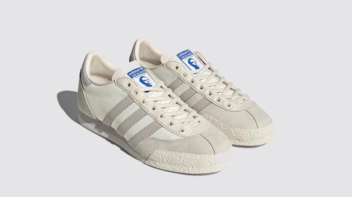 Best sneaker collabs - Liam Gallagher x adidas LG2 SPZL product image of a cream white and grey pair of shoes featuring a graphic of Liam Gallagher on the tongues.