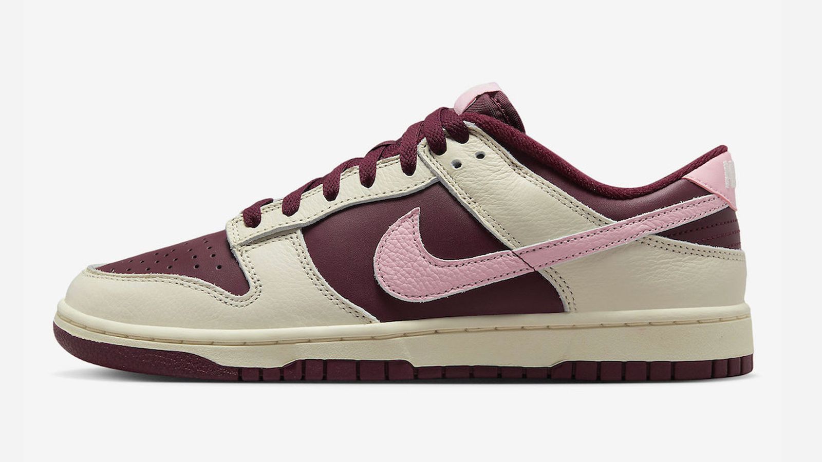 Best sneakers for Valentine's Day - Nike Dunk Low "Night Maroon and Medium Soft Pink" product image of a Cream and Maroon sneaker with a Pink Swoosh.