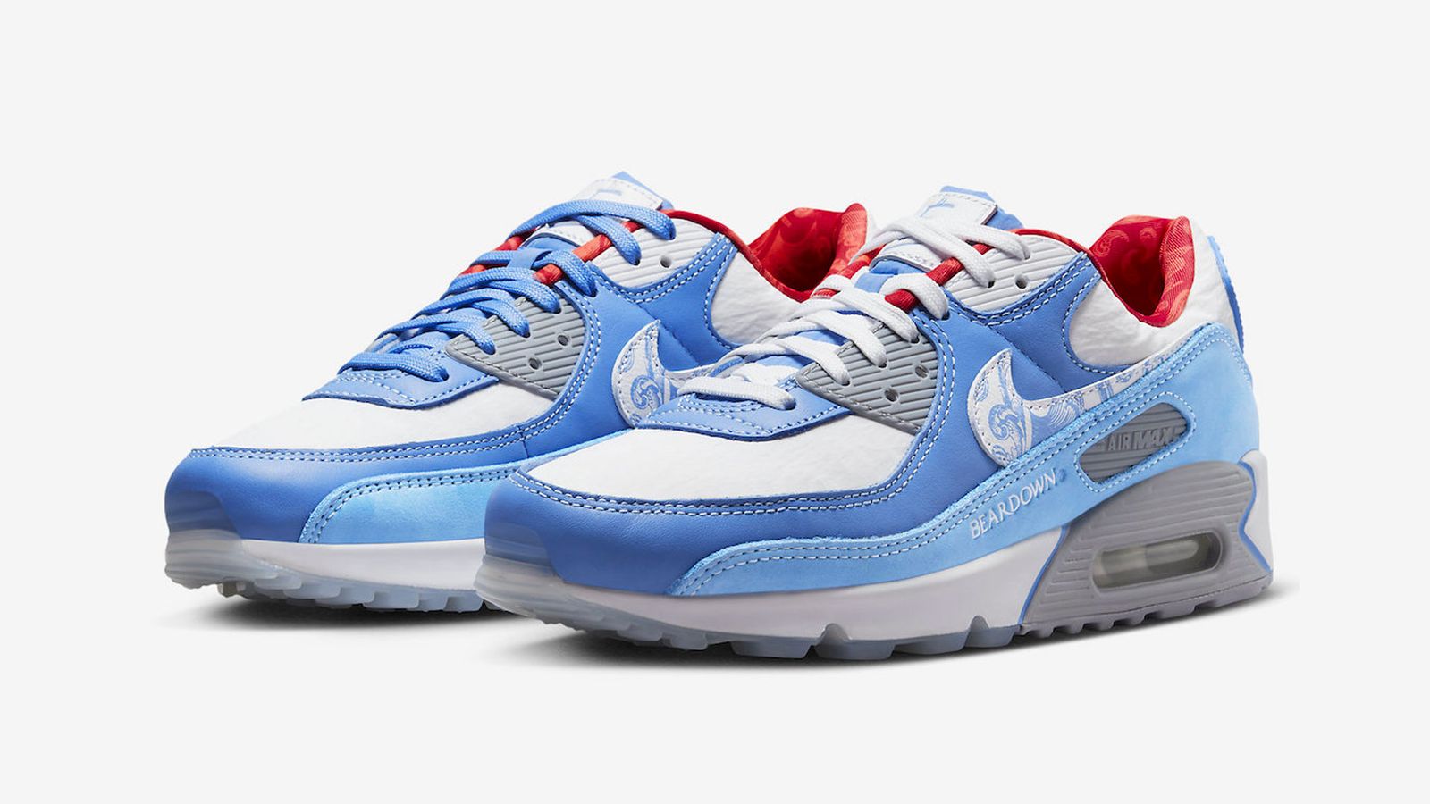 Air Max Day 2023 - Nike Air Max 90 "Doernbecher" product image of a blue and white pair of sneakers with red accents.