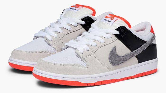 How to lace Dunks - Nike Dunk product image of a pair of grey, black, red, and white sneakers with bright white laces.