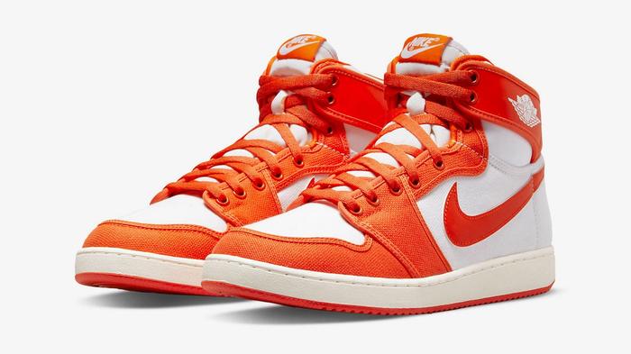 Best Air Jordan 1 Colorway "Rush Orange" KO product image of bright orange and white leather and canvas sneakers.