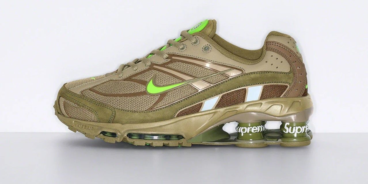 Supreme x Nike Shox Ride 2 product image of an olive green pair of sneakers with Supreme-branded cushioning columns in the heels.