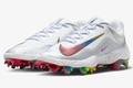 A pair of white and silver cleats featuring multicoloured Swooshes wrapping around the front to match the underfoot plates.