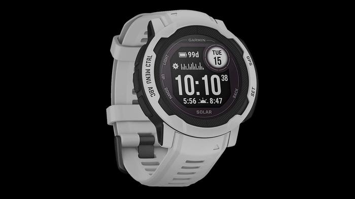 Best Garmin watch for hiking Instinct 2 product image of a mist grey smartwatch with the time, date, battery, and sun information on the display.