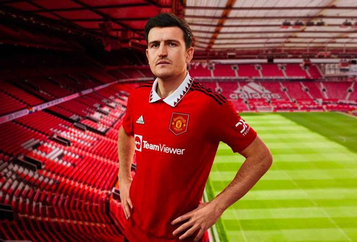 Best football kits 2022/23 Manchester United home kit product image of a red shirt with a white and black collar.