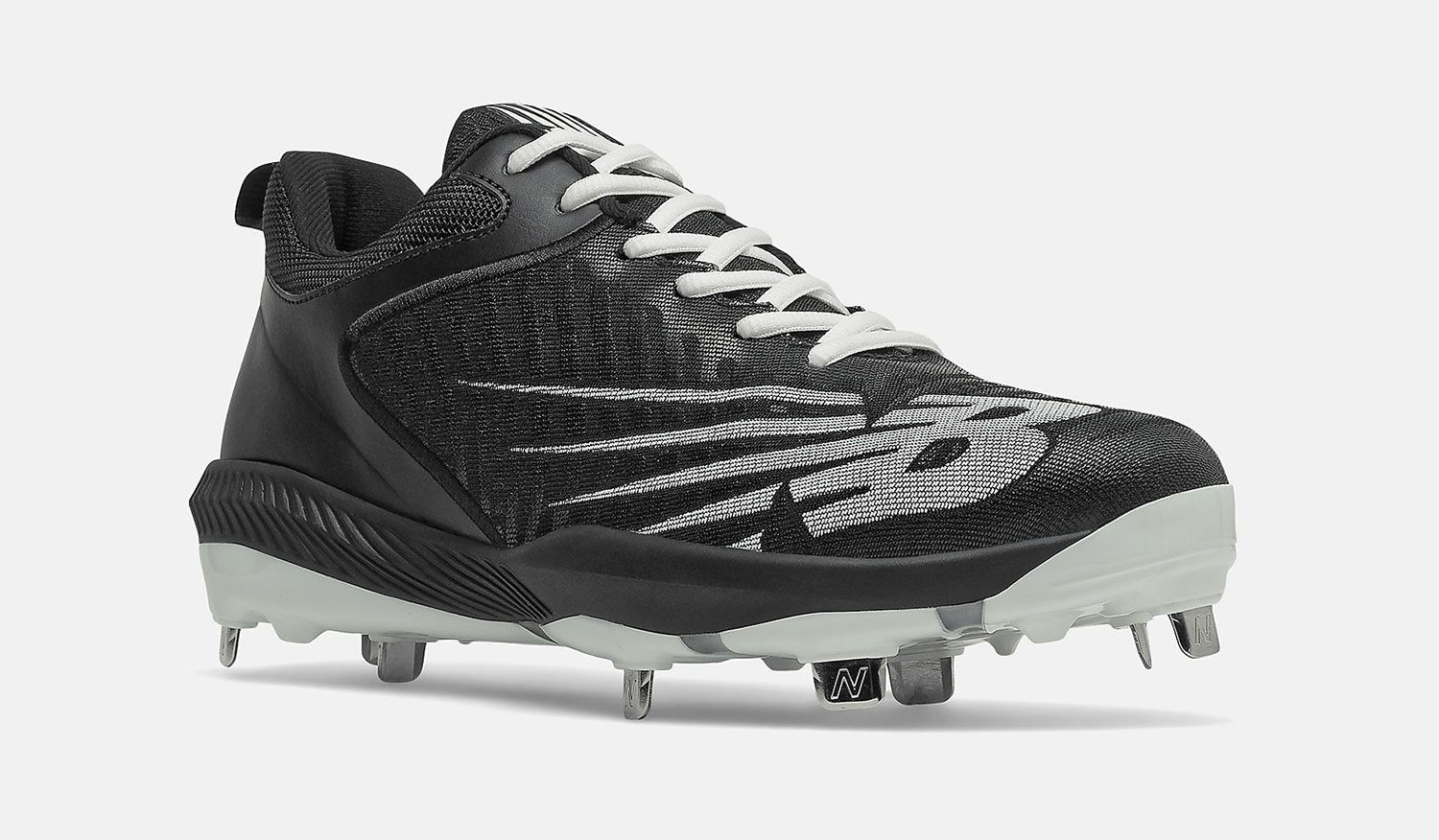New Balance FuelCell 4040 v6 product image of a black cleat with grey New Balance branding along the side.