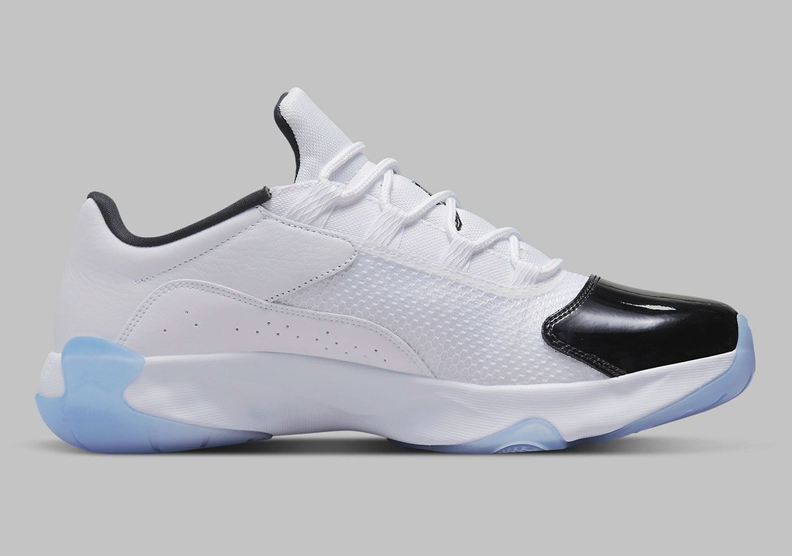 Air Jordan 11 CMFT Low "Concord" product image of a white and black leather sneaker with a translucent blue outsole.