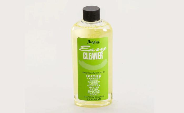 Angelus Easy Cleaner product image of a clear bottle containing light green shoe cleaner.