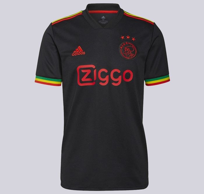 Best football kits 2021/22 Ajax Third kit product image of a black shirt with yellow, green, and red details.