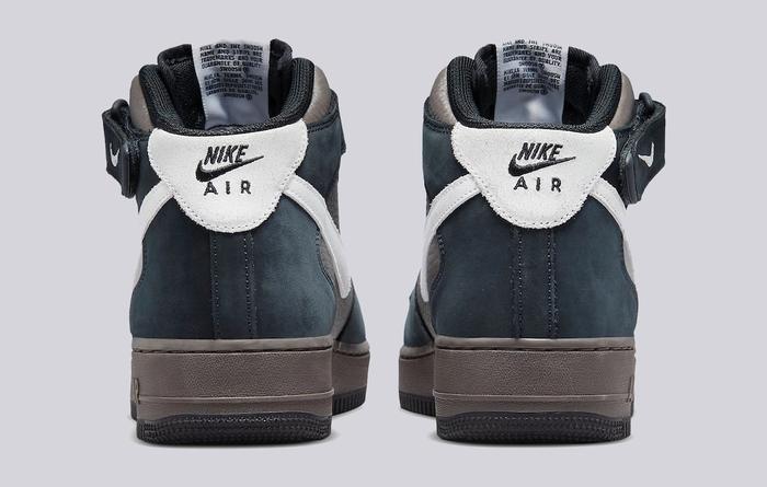 Nike Air Force 1 Mid "Berlin" product image of a black suede and brown leather sneaker with white details.
