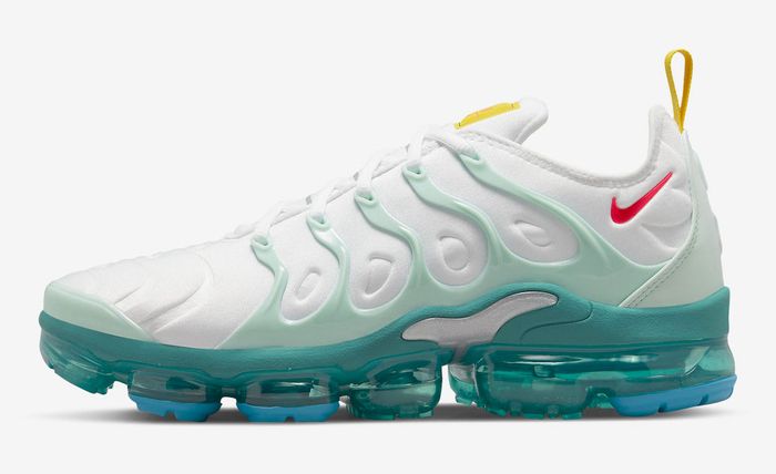 Nike Air VaporMax Plus “Since 1972” product image of a white sneaker with teal, red, and yellow accents.