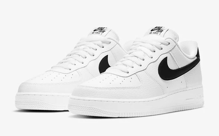 Nike '07 Air Force 1 product image of white sneakers with black Swooshes.