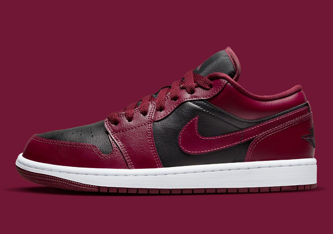 Air Jordan 1 Low Wine Red product image of a black sneaker with dark red, almost beetroot-like overlays.