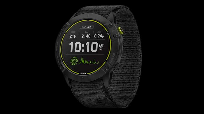 Best Garmin watch for hiking Endur product image of a black fabric band smartwatch with a white and green coloured display.