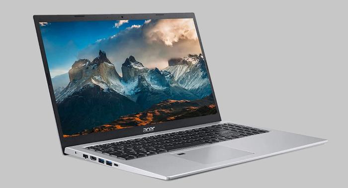 Best laptop for Football Manager 2022 Acer product image of a silver laptop with a mountainous background on the display.