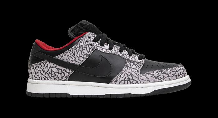 Best Supreme collabs Supreme x Nike Dunk SB Low "Black Cement" product image of a black and elephant-print sneaker with red accents.