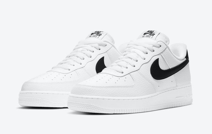 Nike Air Force 1 '07 product image of a white leather sneaker with black details.