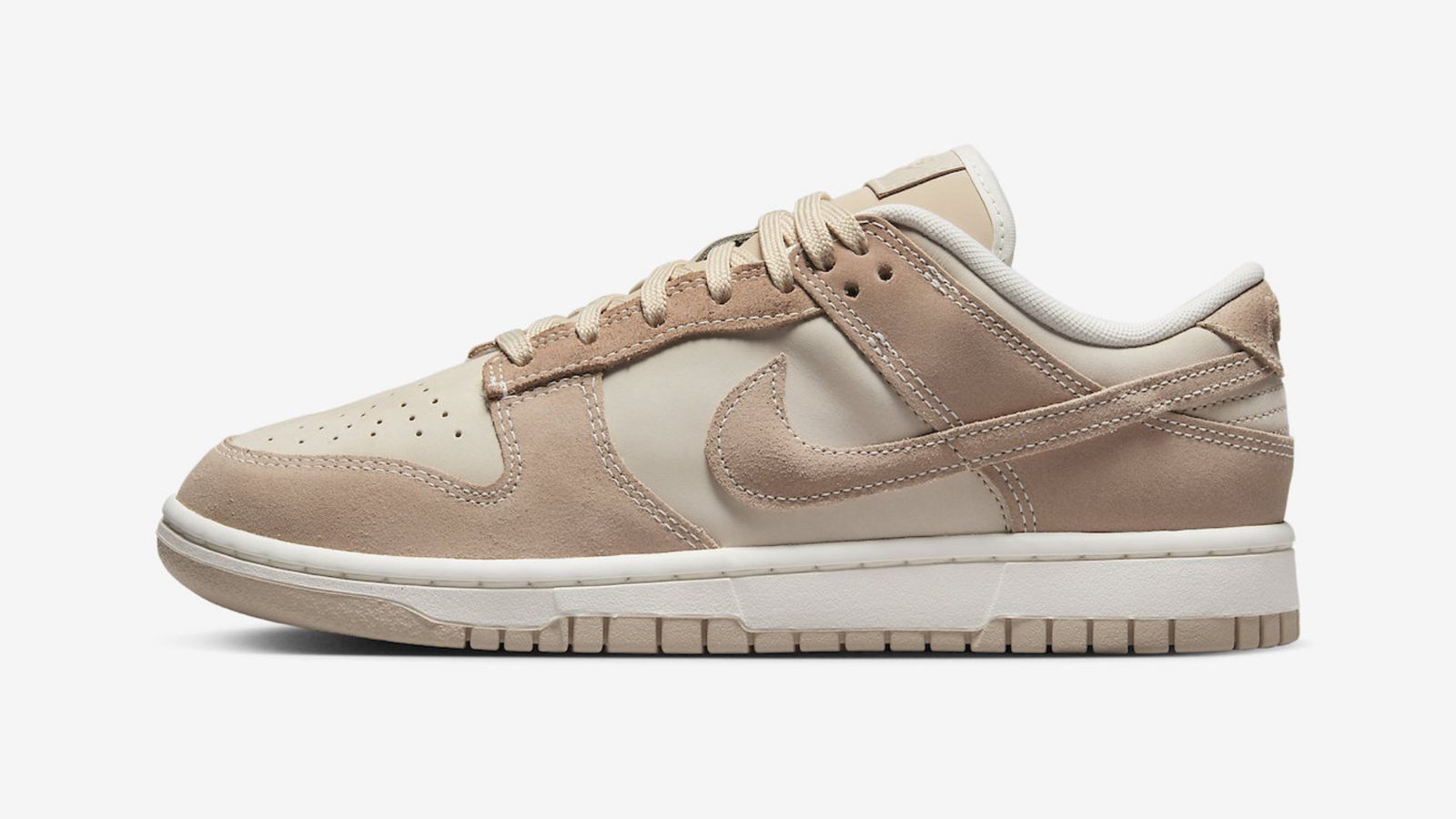 Nike Women's Dunk Low "Sand Drift" product image featuring taupe-coloured leather upper with beige suede overlays accented with contrast stitching and embossed Nike branding. 