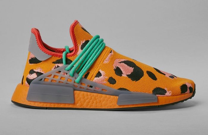 Pharrell x adidas Hu NMD Animal Print Orange product image of an orange sneaker with grey accents and pink and black animal spots.