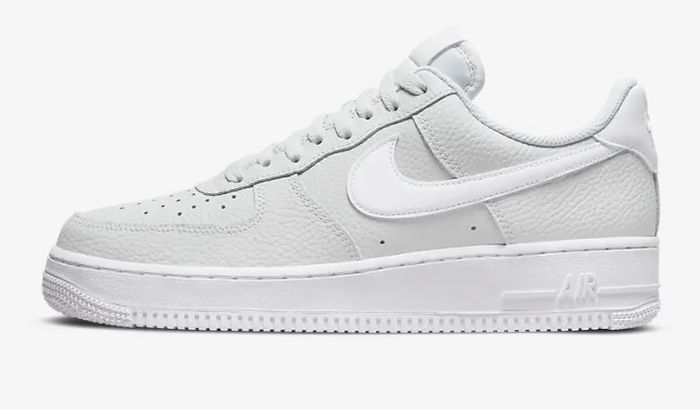 Nike Air Force 1 product image of a pair of white and light grey low-tops.