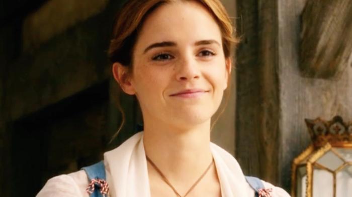 Emma Watson, a woman who was targeted by 4chan with an ai voice generator, smiling 