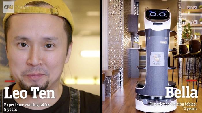 A human waiter and a robot server. 