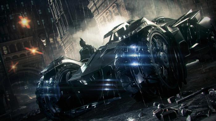 Batman and his Batmobile standing in the rain.